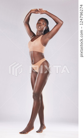 Beauty, body and underwear with a model black woman in studio on a gray background for a health lifestyle. Portrait, health and skincare with an attractive young female posing to promote natural care 124796274