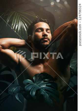 Beauty, body and plants with man in nature for natural and organic bodycare and skincare. Cosmetic, green and health and wellness with a handsome male outside for body care and skin treatment 124796324