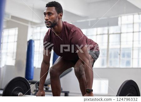 Weightlifting, fitness and man at gym for training, health and exercise, energy and bodybuilding. Bodybuilder, weights and black man with strong mindset focused on cardio, biceps and body workout Weightlifting, fitness and man at gym for training, health and exercise, energy and bodybuilding. Bodybuilder, weights and black man with strong mindset focused on cardio, biceps and body workout 124796332