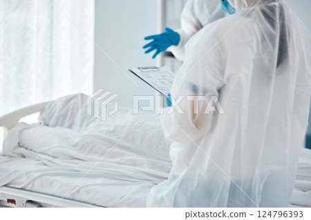 Death, covid and doctors writing paper for patient in a bed at a hospital due to virus. Healthcare, medical and clinic workers with communication, report and help during health crisis in pandemic Death, covid and doctors writing paper for patient in a bed at a hospital due to virus. Healthcare, medical and clinic workers with communication, report and help during health crisis in pandemic 124796393