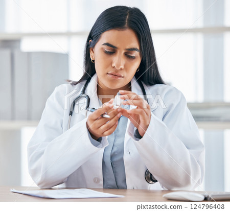 Woman with medication prescription, health and doctor in hospital office, focus and reading instruction label. Healthcare, stethoscope and medical paperwork on desk, vaccine or cold and flu medicine. 124796408