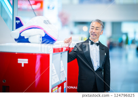 A man checking in at the airport terminal 124796825