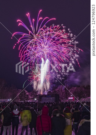 Hokkaido winter fireworks festival and spectators watching the fireworks 124796923