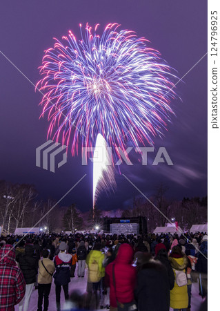Hokkaido winter fireworks festival and spectators watching the fireworks 124796925