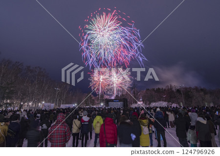 Hokkaido winter fireworks festival and spectators watching the fireworks 124796926