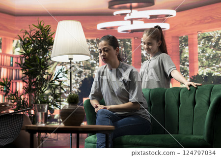 Young girl dealing with derealization and dissociation from reality, mother bringing her to counseling. Adolescent zoned out and struggling to focus during therapy session. Loss of contact. Young girl dealing with derealization and dissociation from reality, mother bringing her to counseling. Adolescent zoned out and struggling to focus during therapy session. Loss of contact. 124797034