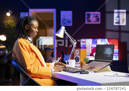 Freelancing computer engineer doing maintenance on artificial intelligence systems. Remote tech support specialist working from home, doing checkup on AI systems using laptop Freelancing computer engineer doing maintenance on artificial intelligence systems. Remote tech support specialist working from home, doing checkup on AI systems using laptop 124797141
