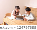 Elementary school boys and girls studying on tablets 124797688
