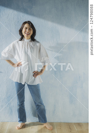 Middle-aged woman in denim Middle-aged woman in denim 124798088