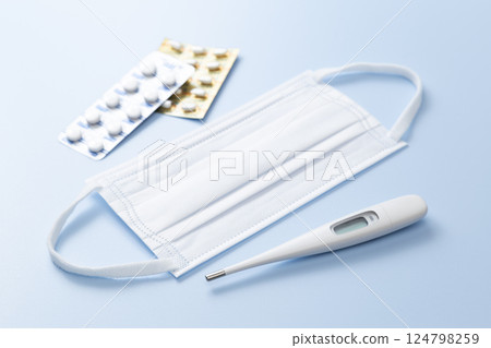 Cold medicine, mask and thermometer 124798259