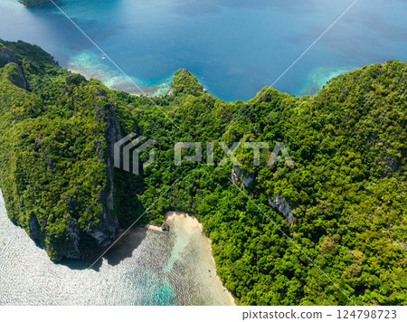 Sun reflection over turquoise clear water with sun reflection. Cadlao Island. El Nido, Palawan. Philippines. Sun reflection over turquoise clear water with sun reflection. Cadlao Island. El Nido, Palawan. Philippines. 124798723