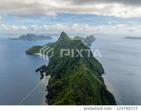 Tropical beaches in Matinloc Island. Blue sky and clouds. El Nido, Philippines. Tropical beaches in Matinloc Island. Blue sky and clouds. El Nido, Philippines. 124798725