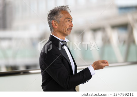 Portrait of a senior man in a tuxedo Portrait of a senior man in a tuxedo 124799211
