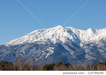 Mount Ontake in winter illuminated by the morning sun Mount Ontake in winter illuminated by the morning sun 124799290