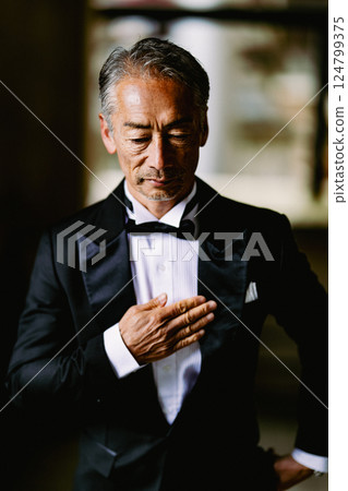 Portrait of a senior man in a tuxedo 124799375