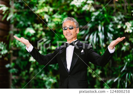 Portrait of a senior man against a green background Portrait of a senior man against a green background 124800258