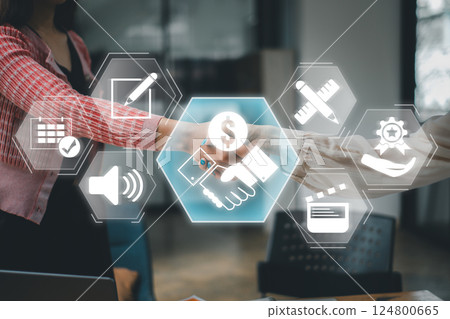 Visual representation of sponsorship with handshake and digital icons symbolizing collaboration and support. 124800665