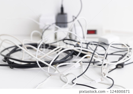 Outlet and tangled cord Outlet and tangled cord 124800871