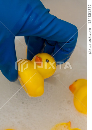 a composition of yellow rubber ducks demonstrating the need for hygienic toy handling a composition of yellow rubber ducks demonstrating the need for hygienic toy handling 124801832