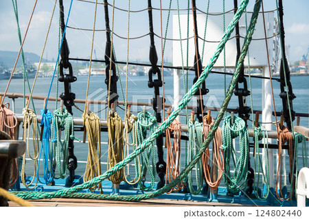Marine equipment on the deck of a ship. Marine ropes and different tackles. Marine equipment on the deck of a ship. Marine ropes and different tackles. 124802440
