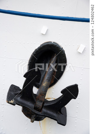 Detail of a ship's hull and anchor. Vertical orientation. Copy space. Detail of a ship's hull and anchor. Vertical orientation. Copy space. 124802462