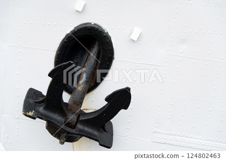 Detail of a ship's hull and anchor. Copy space. Detail of a ship's hull and anchor. Copy space. 124802463