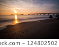 Beautifull sunrise over the sea and the broken pier - long exposure, low light. 124802502