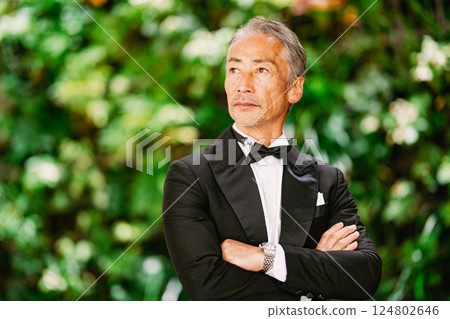 Portrait of a senior man against a green background Portrait of a senior man against a green background 124802646