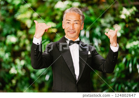 Portrait of a senior man against a green background Portrait of a senior man against a green background 124802647