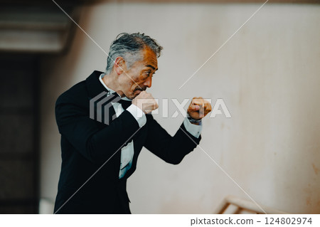 Senior man fighting, throwing punches 124802974