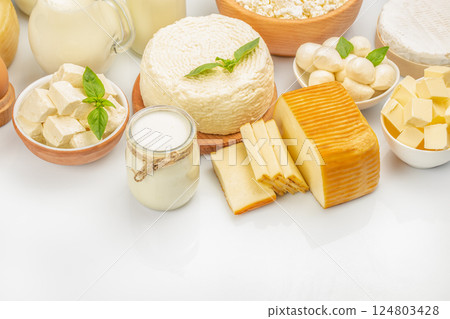Assorted dairy product milk, cream, yogurt, butter, cheese, cottage cheese on a light background, top view. copy space 124803428