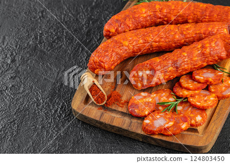 Set of Salami, chorizo, Meat antipasto platter on black background. Top view 124803450