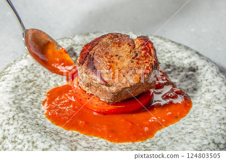 Grilled beef tenderloin steak pour demi glace sauce Grilled beef tenderloin steak pour demi glace sauce 124803505