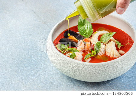 tomato soup with seafood, cold tomato soup or gazpacho, top view. copy space for text tomato soup with seafood, cold tomato soup or gazpacho, top view. copy space for text 124803506