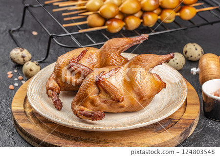 Grilled quails carcasses with smoked eggs bio organic eggs from local farm, copy space 124803548