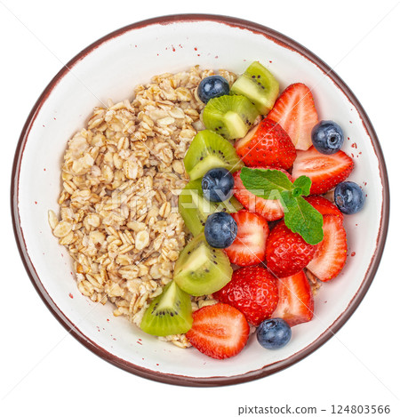 Oatmeal porridge in bowl topped with fresh berries isolated on white background. top view Oatmeal porridge in bowl topped with fresh berries isolated on white background. top view 124803566