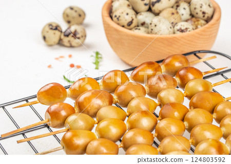 smoked eggs quail on a skewer on a white background. Healthy fats, clean eating for weight loss. top view. copy space 124803592