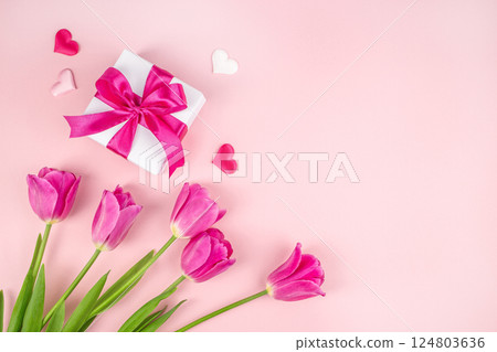 beautiful tulips with gift box hearts on a light pink background. happy mothers day, top view. copy space 124803636