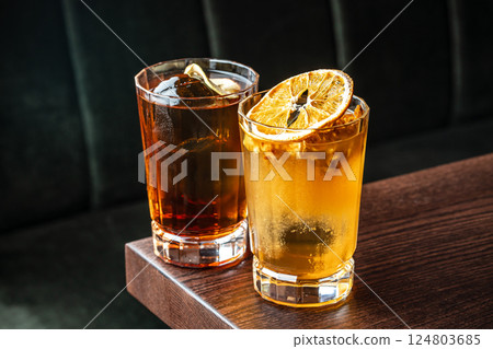 Two glasses of alcoholic cocktails with ice 124803685