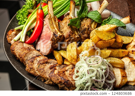 platter of different kebabs from chicken fillet, pork kebab of veal. Top view platter of different kebabs from chicken fillet, pork kebab of veal. Top view 124803686