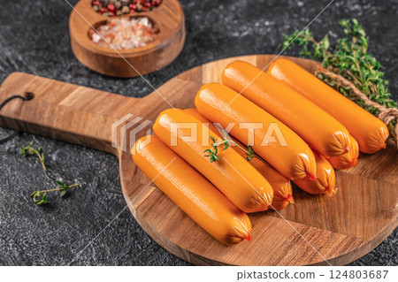 Boiled sausages on a wooden board, top view. copy space Boiled sausages on a wooden board, top view. copy space 124803687