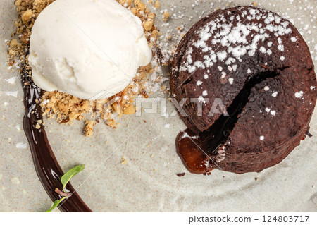 dessert cake or fondant with ice cream on a plate, close up dessert cake or fondant with ice cream on a plate, close up 124803717