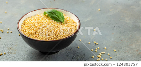 pasta ptitim decorated basil leaves, Long banner format. top view. copy space for text 124803757