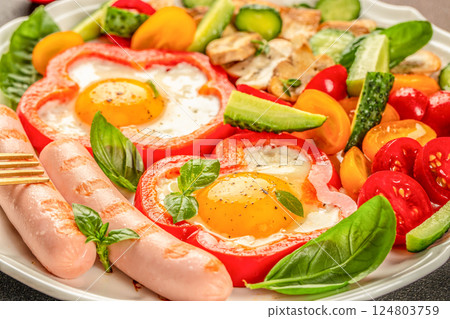Traditional full English breakfast with fried eggs, sausages, mushrooms, vegetables. top view Traditional full English breakfast with fried eggs, sausages, mushrooms, vegetables. top view 124803759