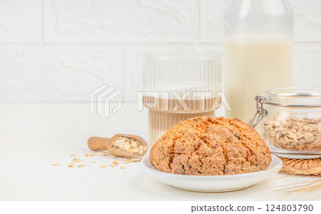 Homemade oatmeal cookies with a glass of latte on a light background. space for text 124803790