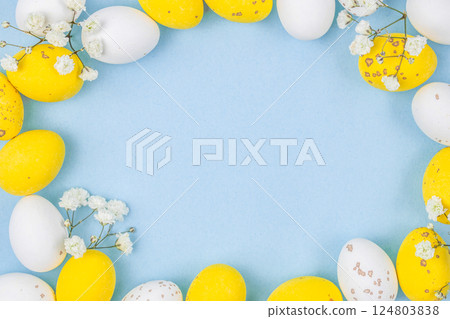 Flat lay composition of Happy Easter holiday concept. Colorful from little pastel eggs on blue background. top view, copy space 124803838