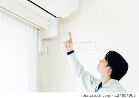 Workers inspecting air conditioners Workers inspecting air conditioners 124804068