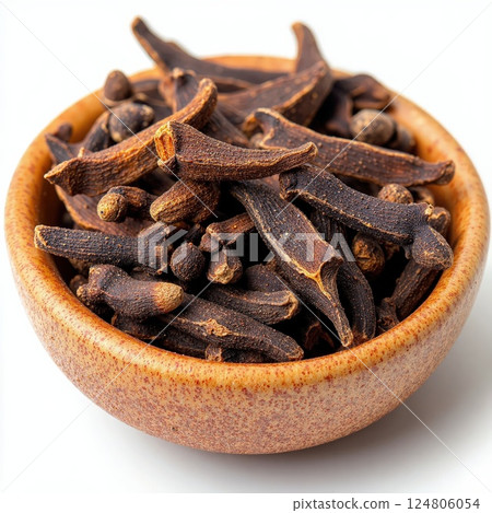 Aromatic cloves in rustic bowl - spices for culinary creativity, recipe design, or kitchen decor 124806054