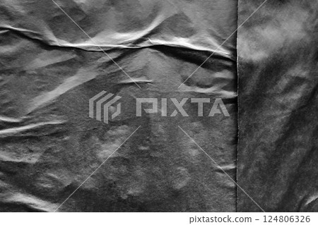 Black crumpled and creased paper poster grunge texture background Black crumpled and creased paper poster grunge texture background 124806326