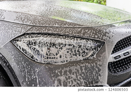 car cleaning and washing with foam soap 124806503